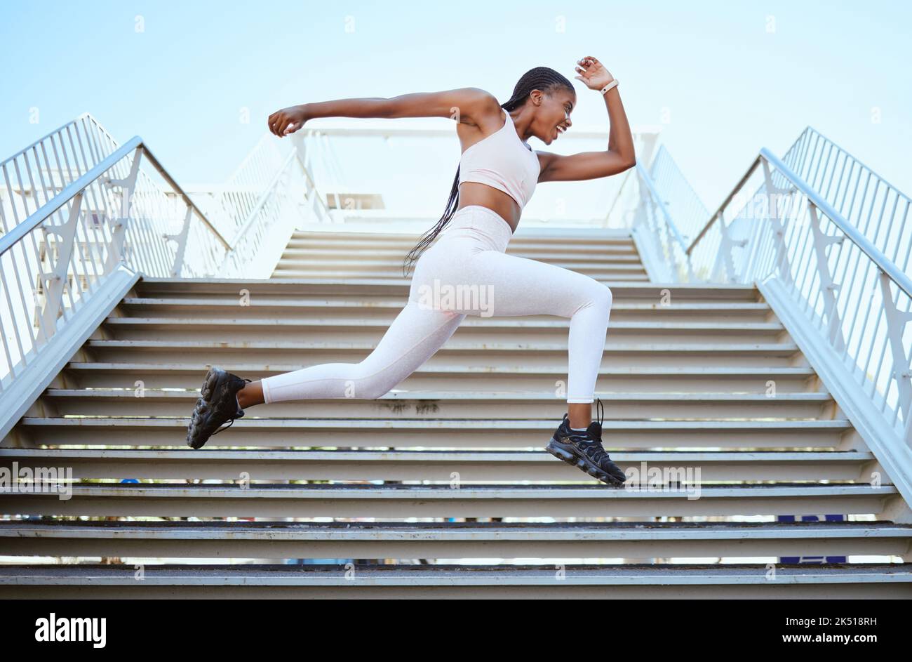 Energy, running and black woman runner on steps for outdoor fitness training, wellness exercise or sports speed challenge. Strong, healthy power of an Stock Photo