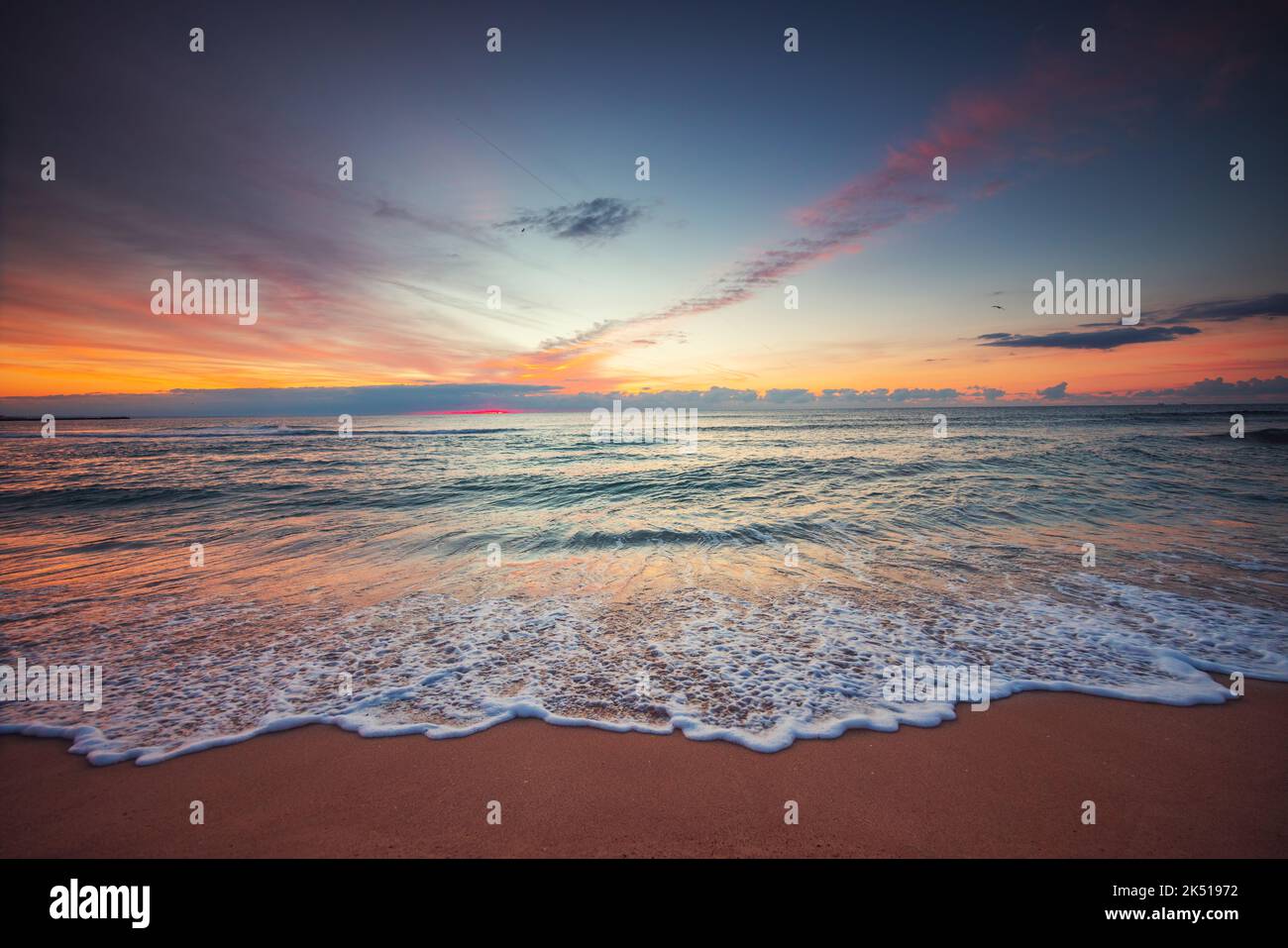 Beach sunrise over the tropical sea Stock Photo - Alamy