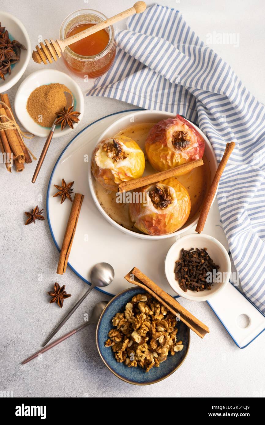 Baked apples with honey and walnuts served with spices Stock Photo Alamy