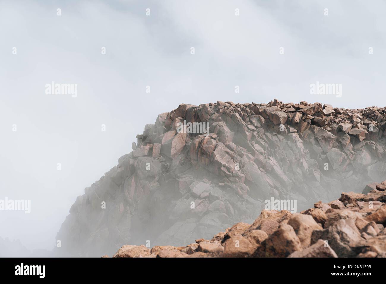 Peak Ropics Rocks The foggy view of the rocks of Pikes Peak under the cloudy sky in ...