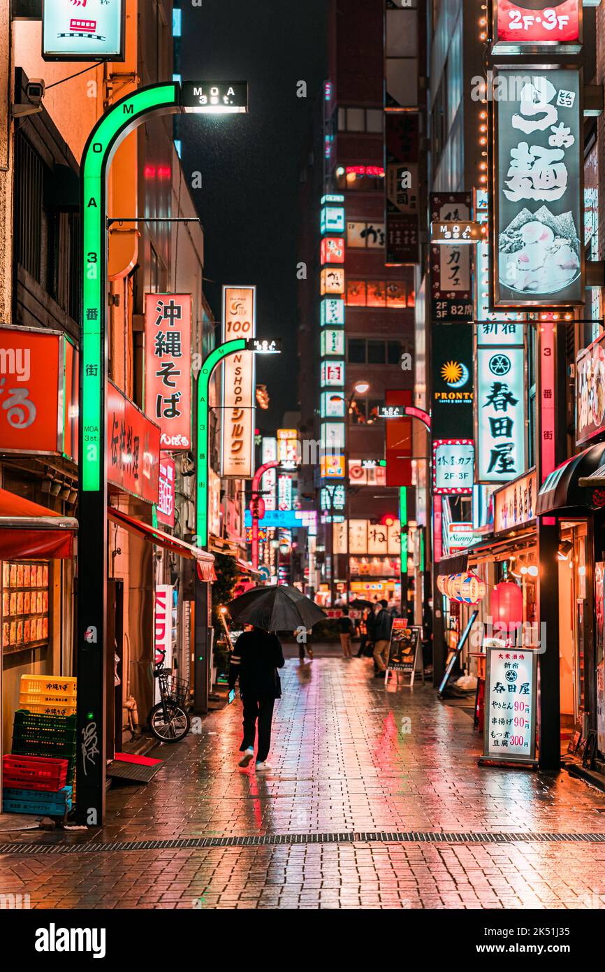 Shinjuku street on a rainy night Stock Photo - Alamy
