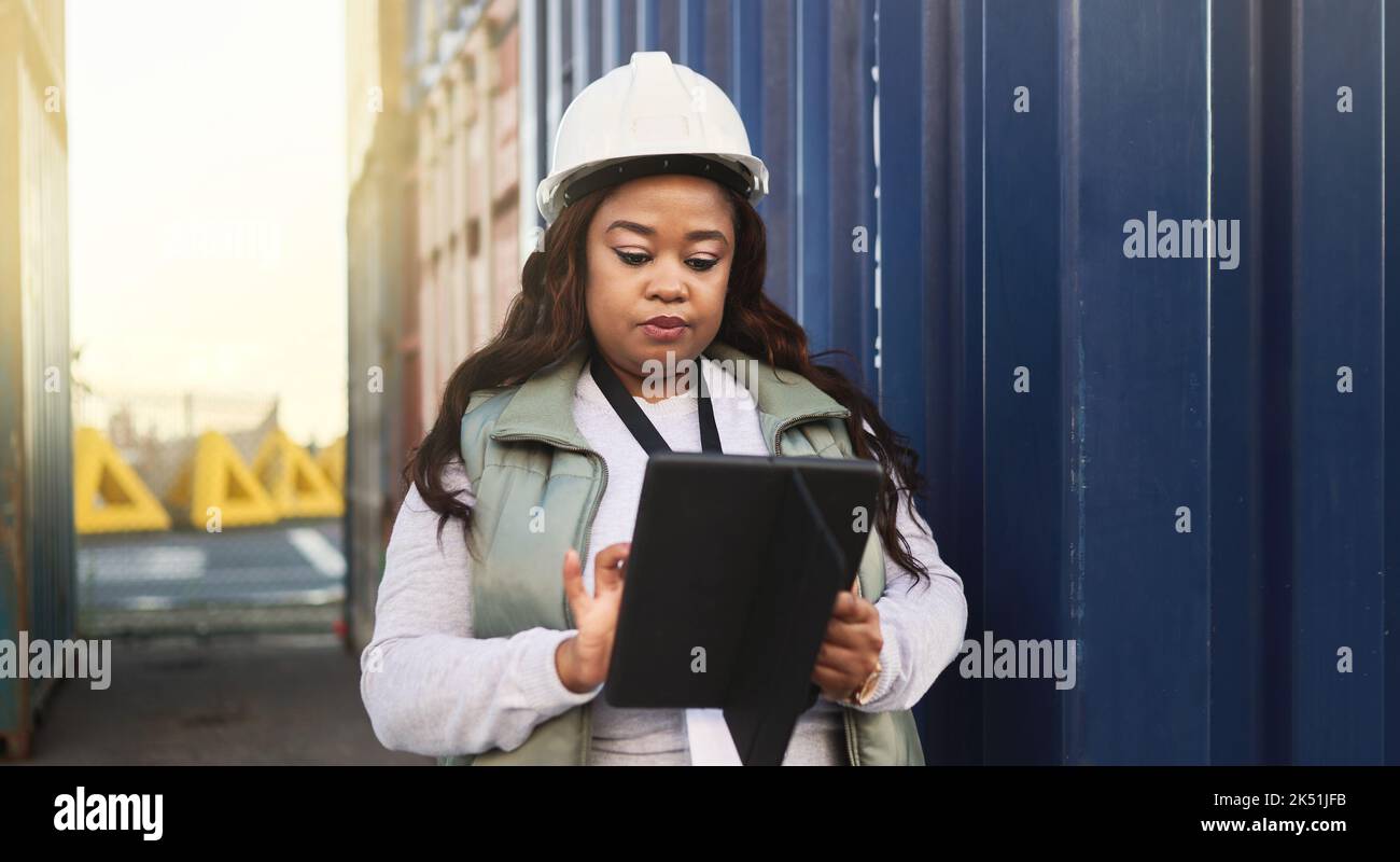Logistics, business and black woman shipping containers being check or ...