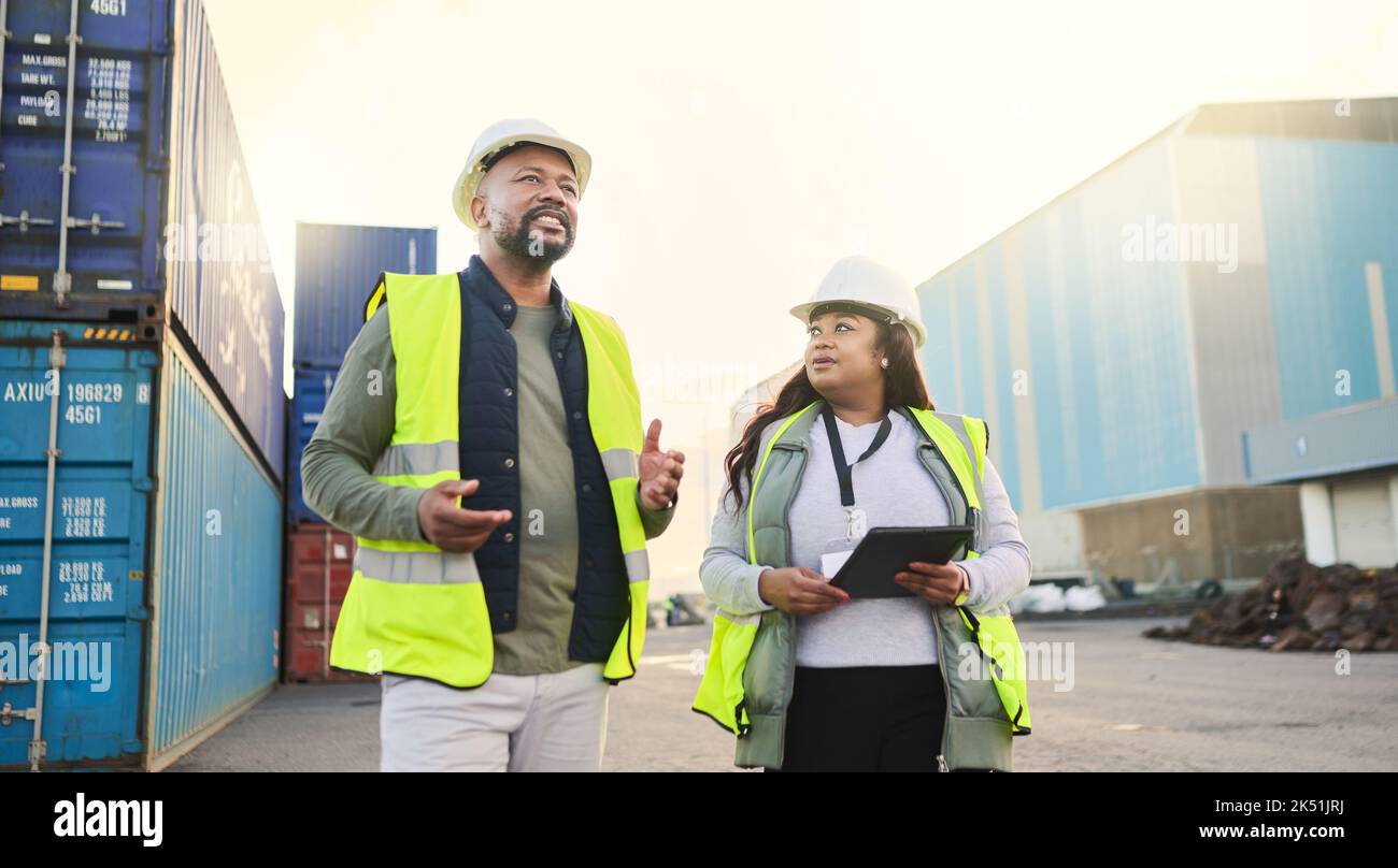 Logistics container, engineer black people manager and supply chain management at a shipping, cargo or freight warehouse. Business industry worker and Stock Photo