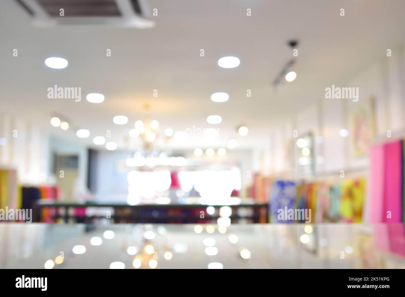 Abstract blurred entrance area of cloth store as background. Clothes shop blur. Stock Photo