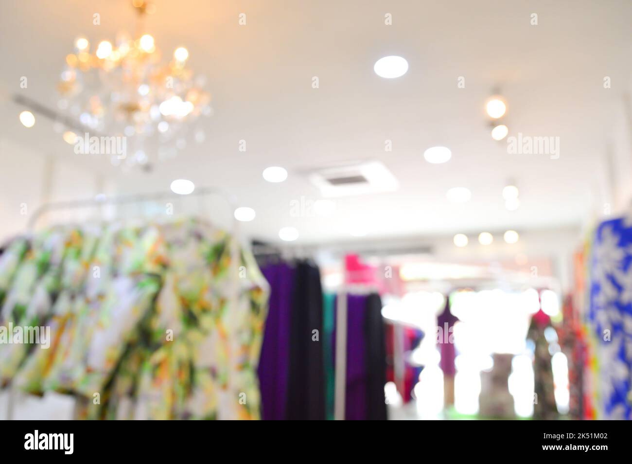 Abstract blurred entrance area of cloth store as background. Clothes shop blur. Stock Photo