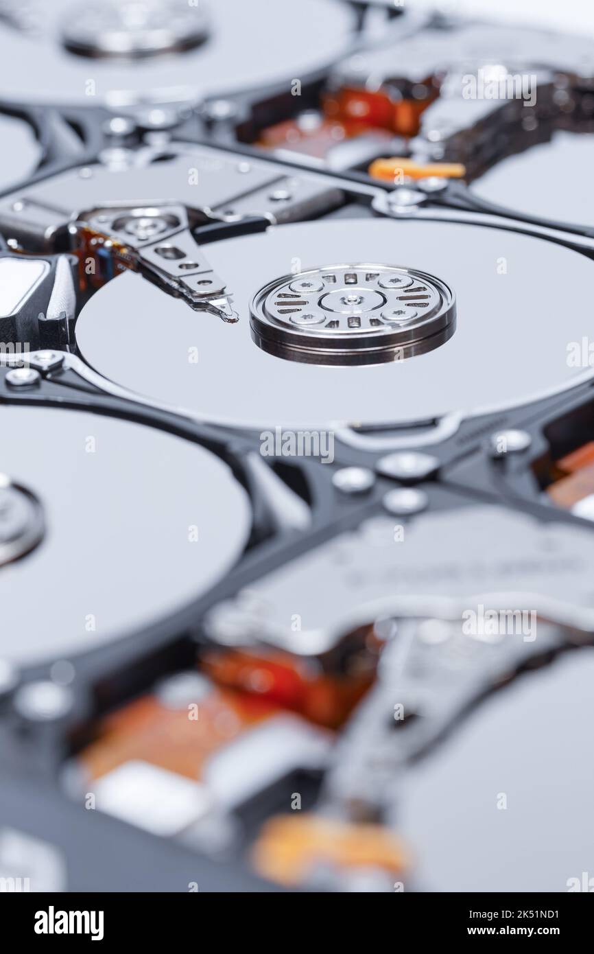 Array of open hard drives with shallow depth of field. Means of information storage. Stock Photo
