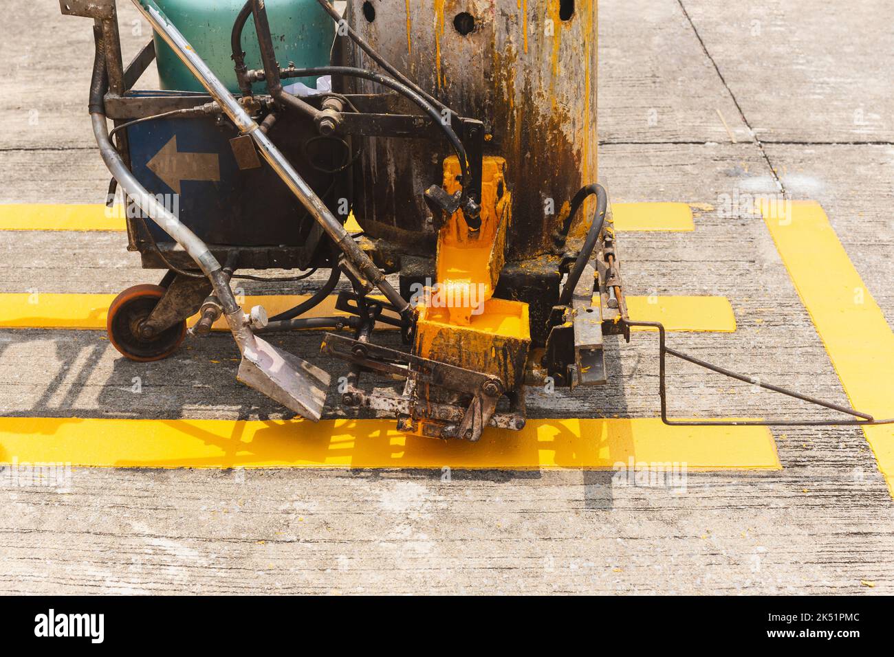 Close up of thermoplastic spray marking machine making lines for