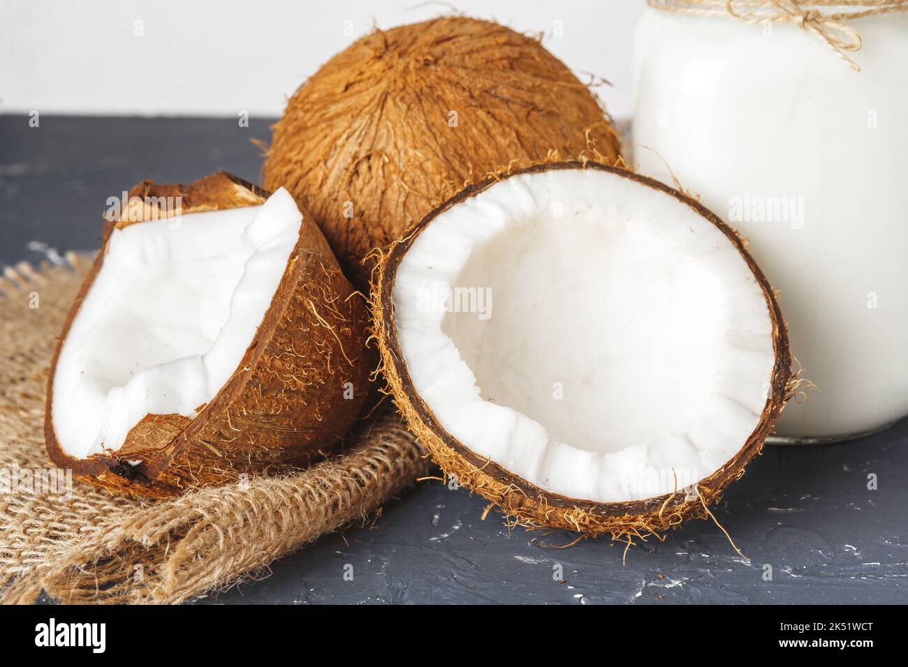 Pile of broken coconuts on ripped grey background Stock Photo Alamy