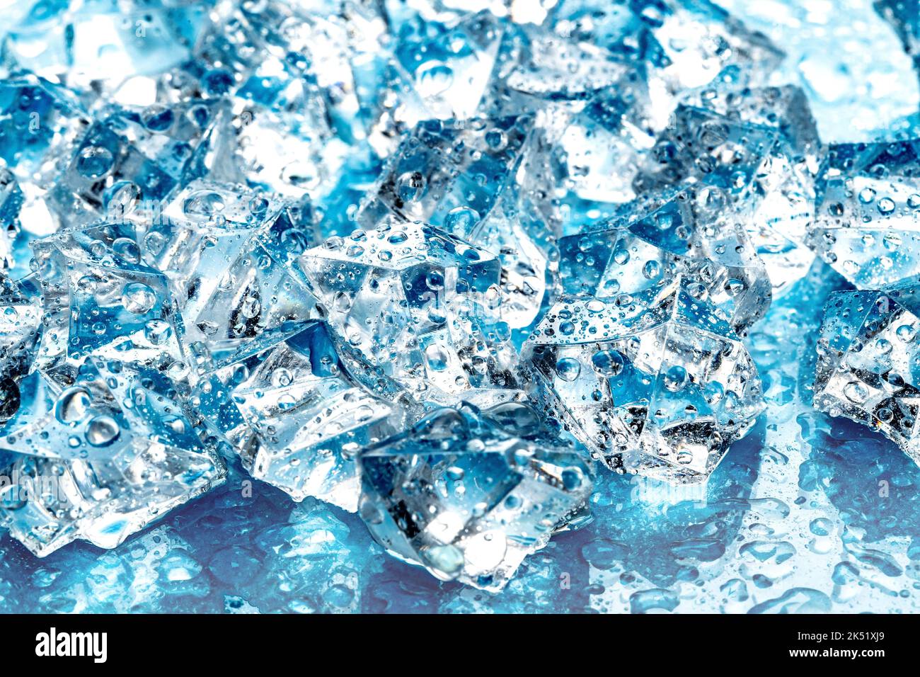 ice cubes on blue background Stock Photo - Alamy