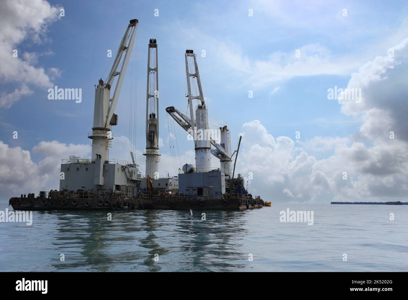 Marine cranes are used for loading and unloading cargo onto ships, The ...