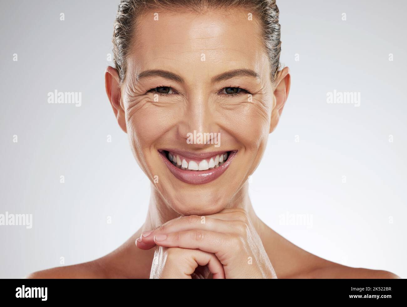 Skincare, anti aging and beautiful mature woman with a smile on her face on white background. Beauty, botox and collagen, a middle aged lady from USA Stock Photo