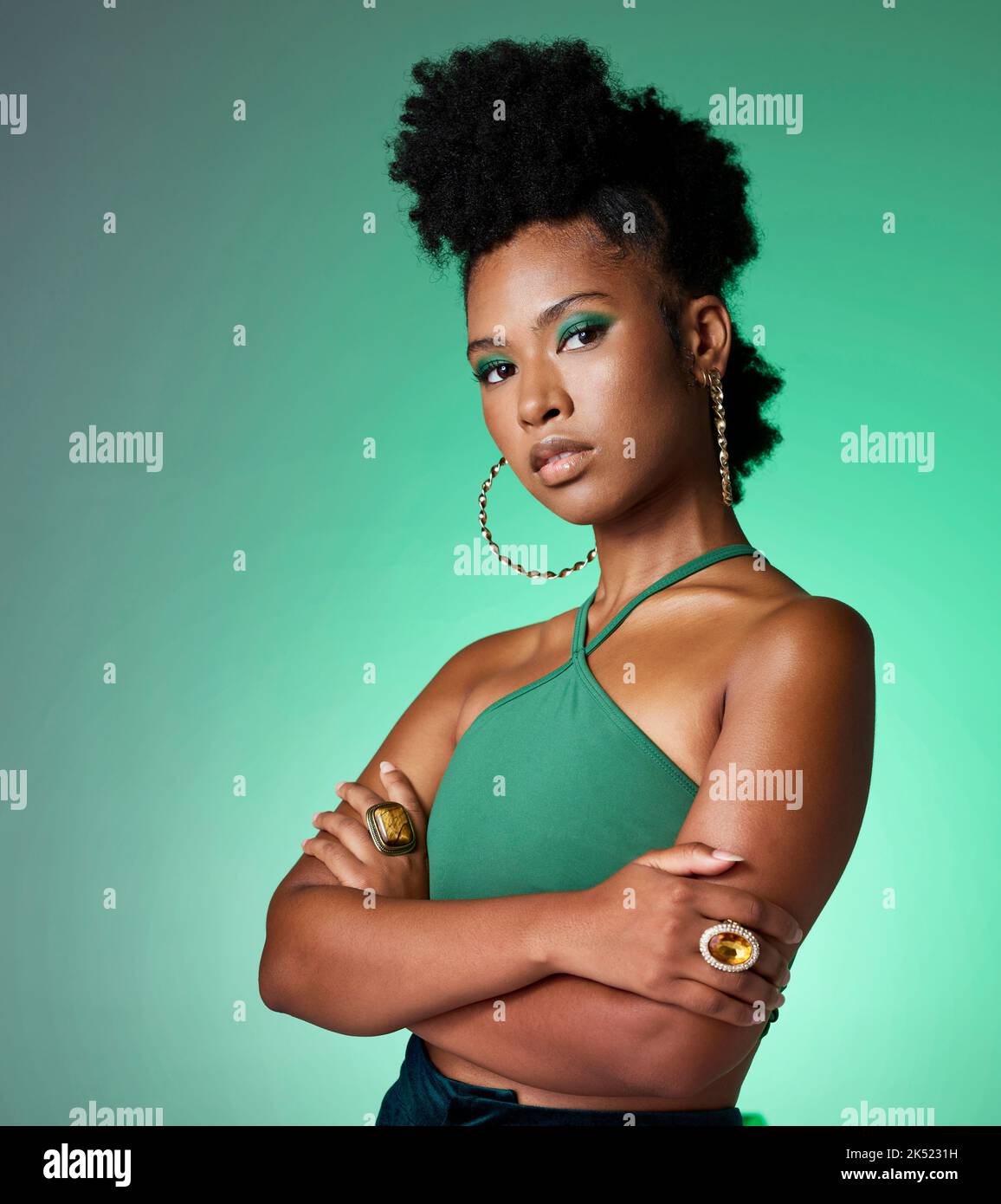 Green screen, face makeup and black woman with power against a green