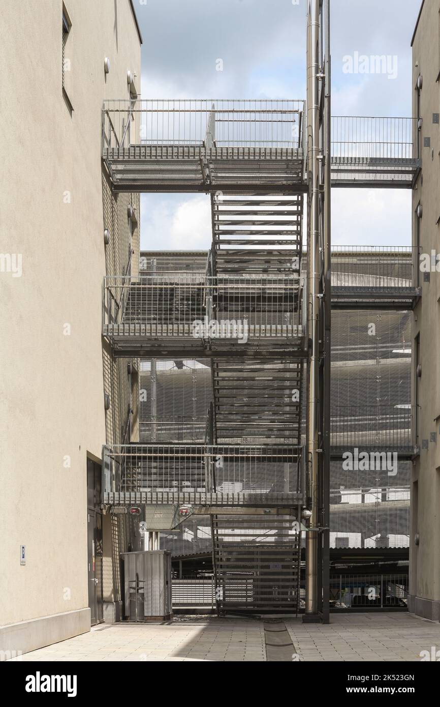 Exterior staircase between two houses at a parking garage Stock Photo