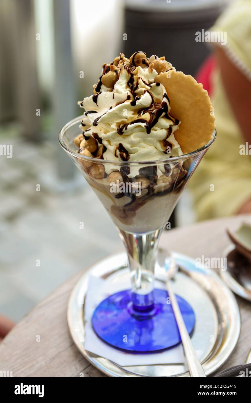 Delicious sundae with nuts and cream Stock Photo
