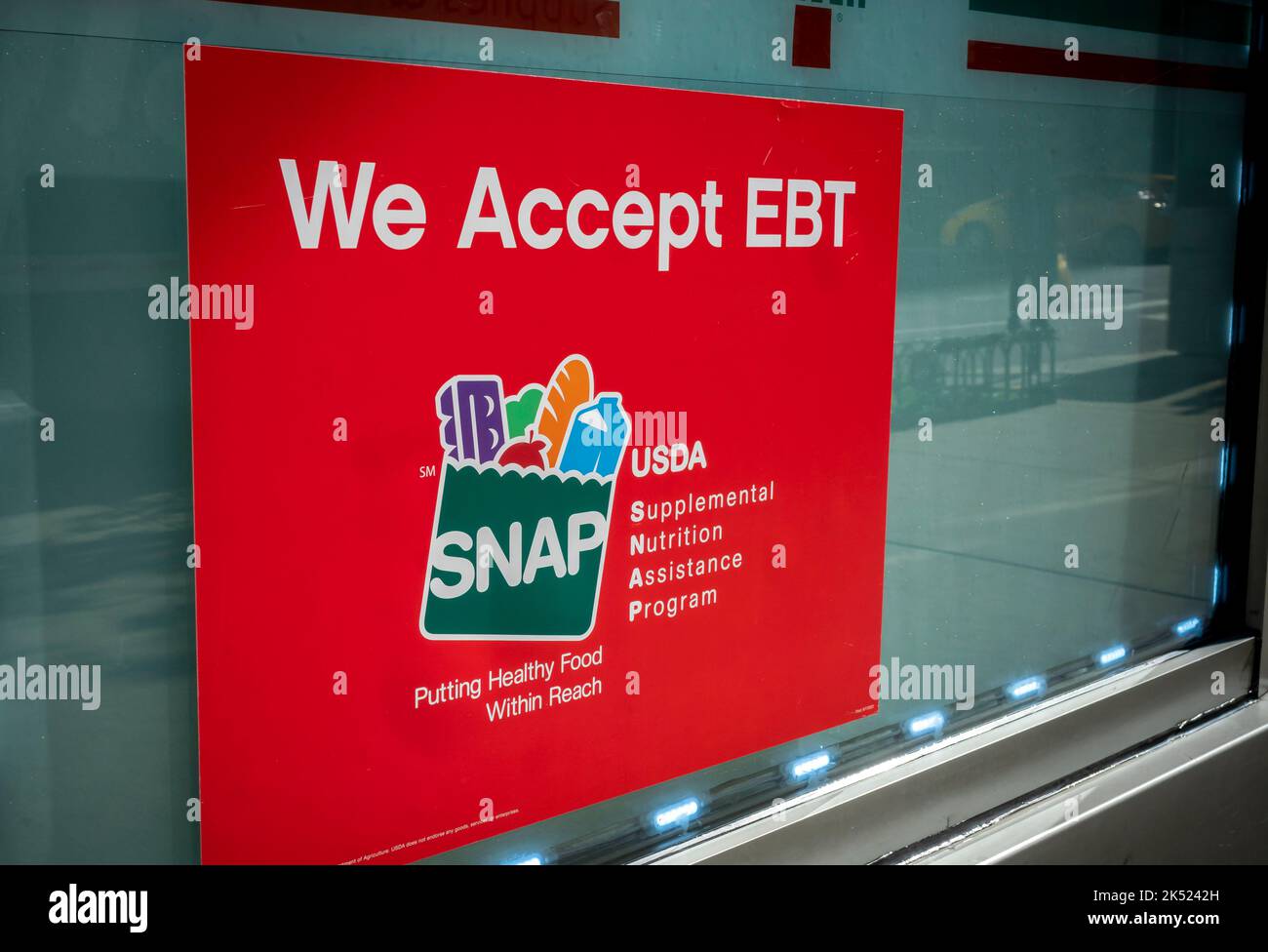 A sign in the window of a 7Eleven in New York announces that the