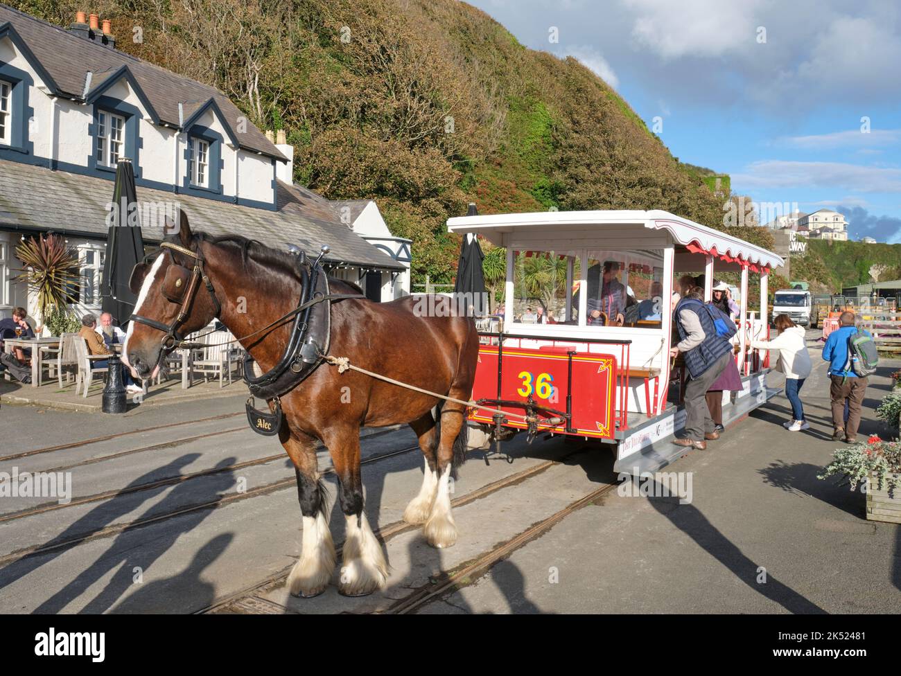 Passengers board a horse drawn tram on Douglas promenade, Isle of Man. Stock Photo