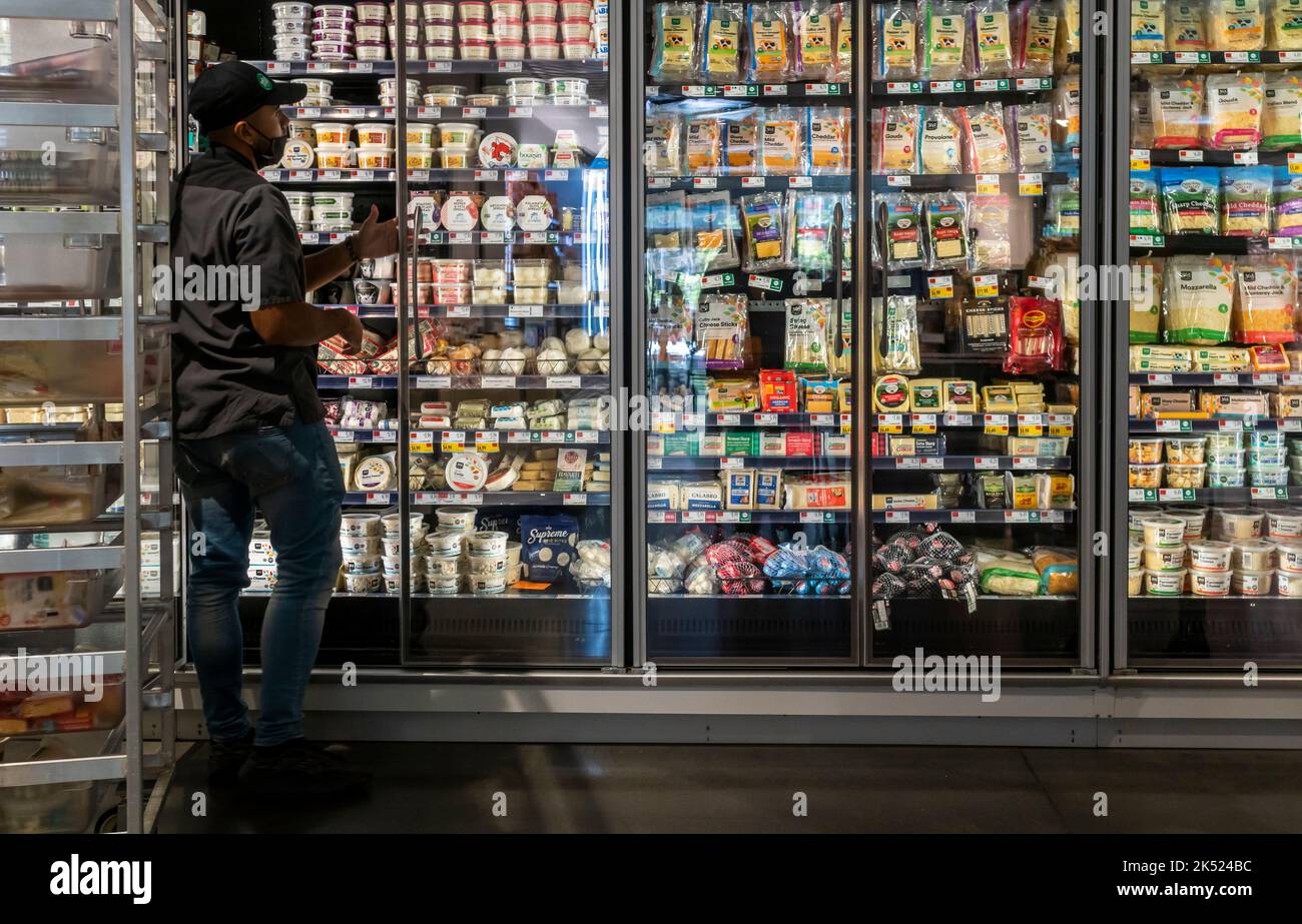 A worker stocks a refrigerator in a Whole Foods Market supermarket in New York on Thursday, September 29, 2022. The Federal Reserve released data that reveals that inflation remains stubbornly high.  (© Richard B. Levine) Stock Photo