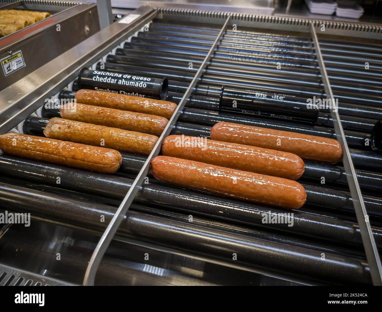 7-Eleven hot dogs endlessly spin on the grill at a franchise in New York on Wednesday, September 28, 2022.  (© Richard B. Levine) Stock Photo