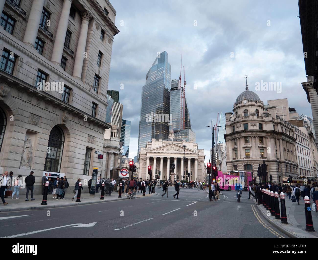View of Financial district,  City of London picture shows London Royal Exchange with pillars in centre with 22 Bishopsgate modern skyscraper behind and Number one Cornhill the domed building to the right Stock Photo