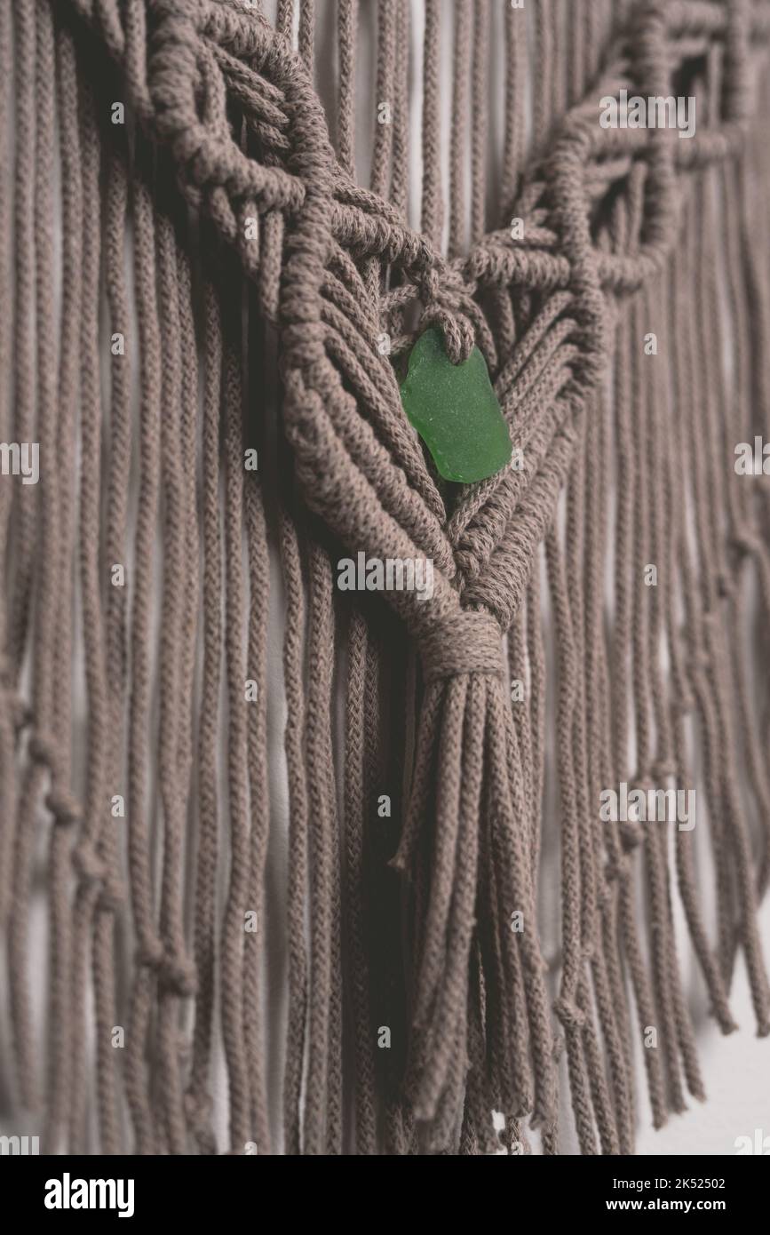 Hand made macrame wall hanging fiber art decoration with heart symbol