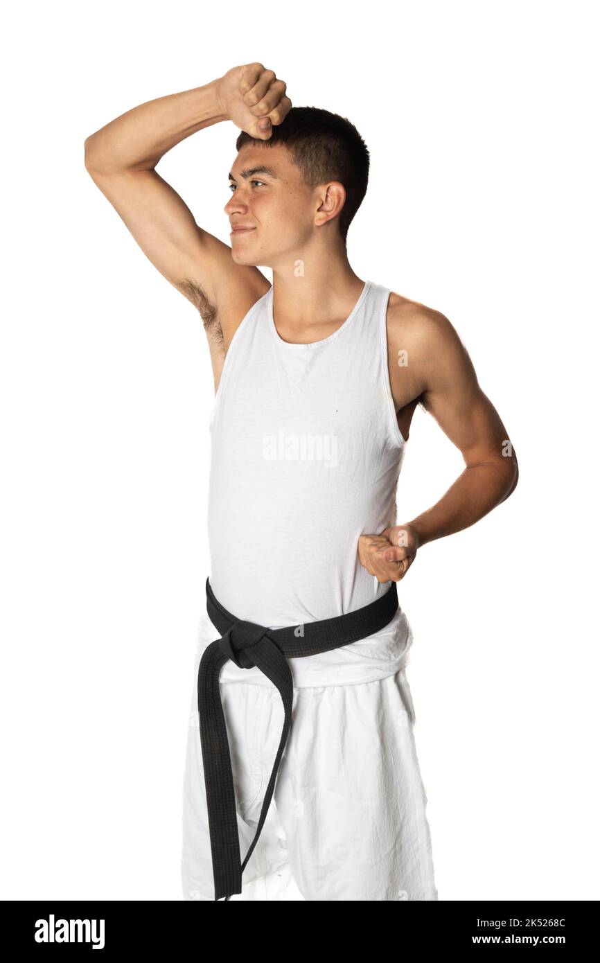 19 Year Old Teenage Boy Practacing a Karate Head Block Block Stock