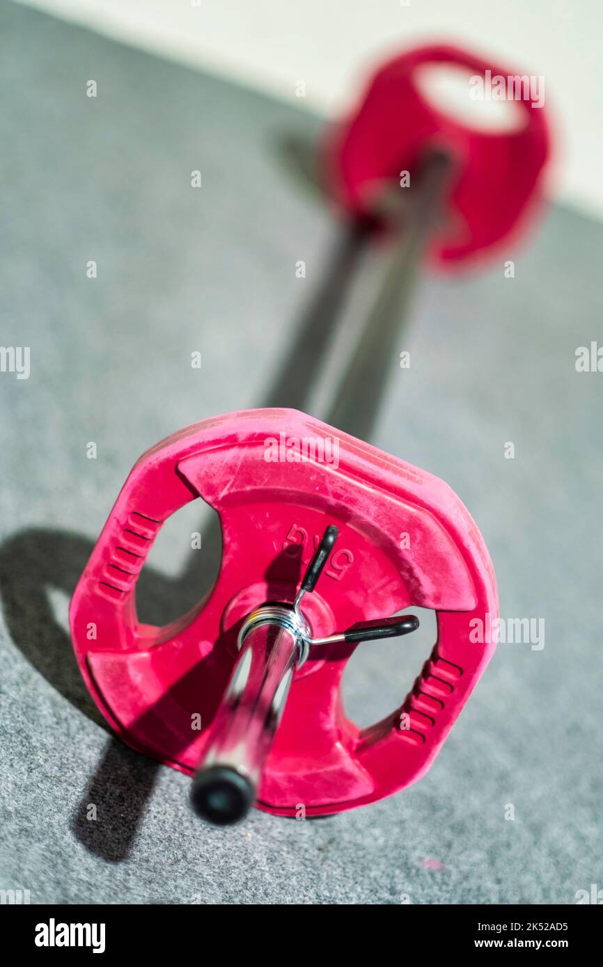 weight lifting bar on the floor in a gym. Fitness concept Stock Photo