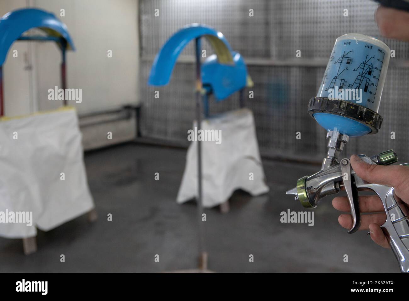 A spray gun for painting vehicle parts Stock Photo Alamy