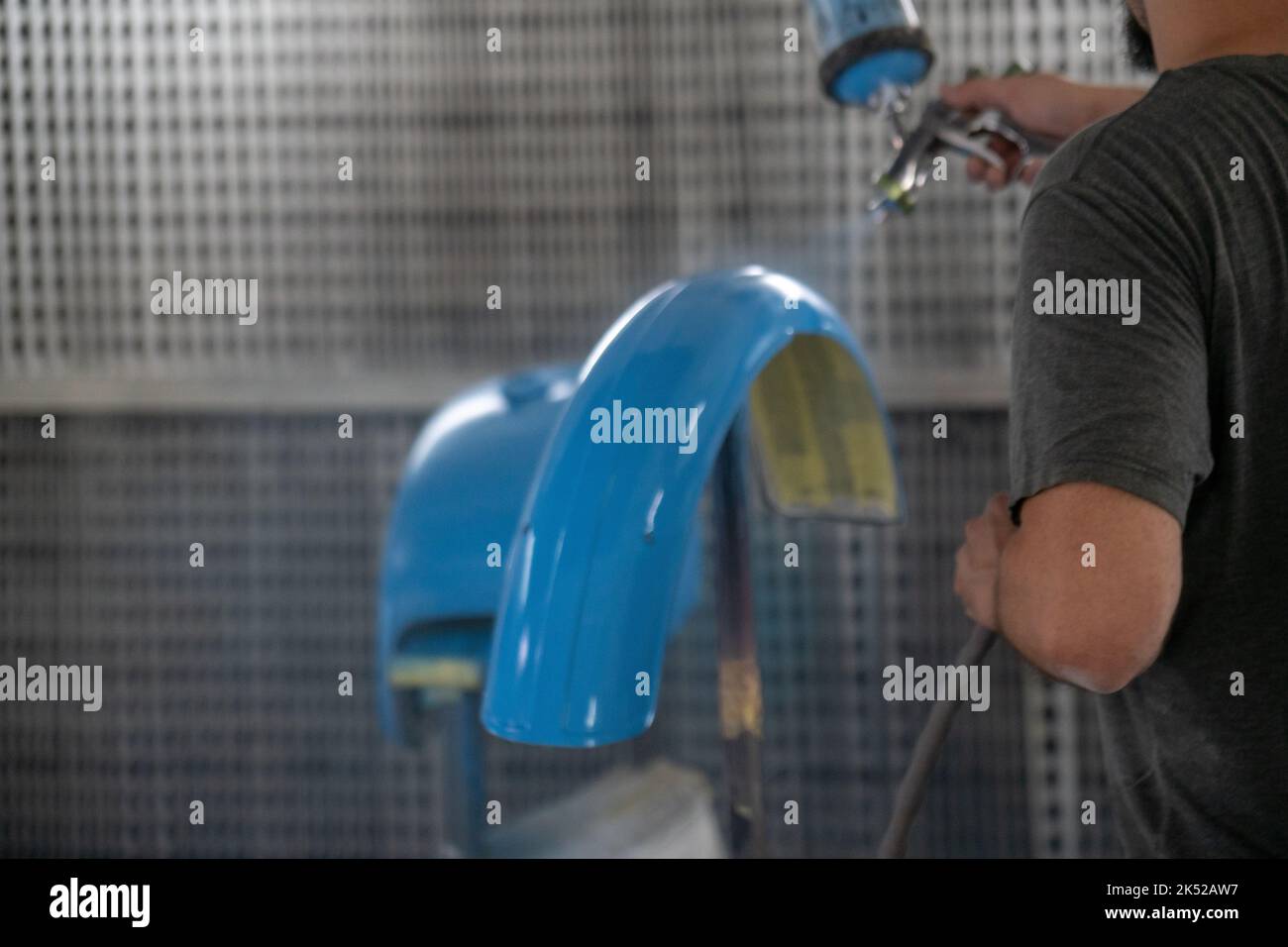 A specialist using spray gun for painting car details Stock Photo Alamy