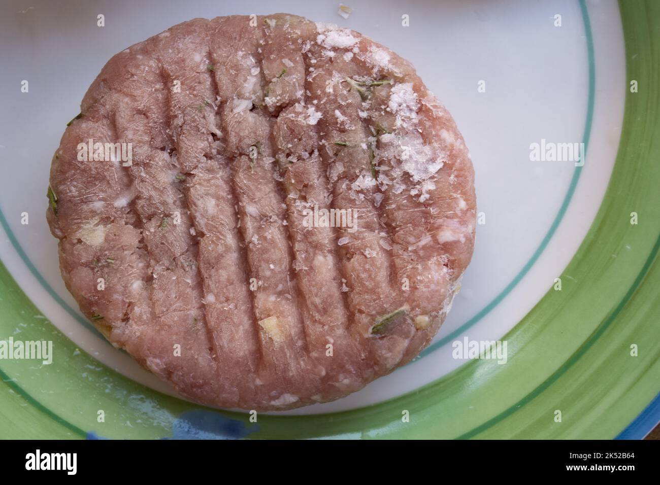 frozen and herbflavored pork burger Stock Photo Alamy