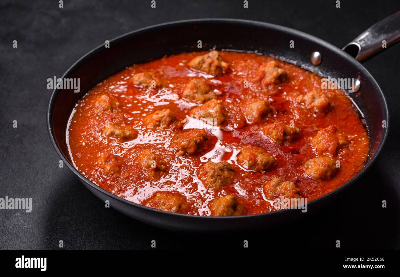 Delicious meatballs made from ground beef in a spicy tomato sauce