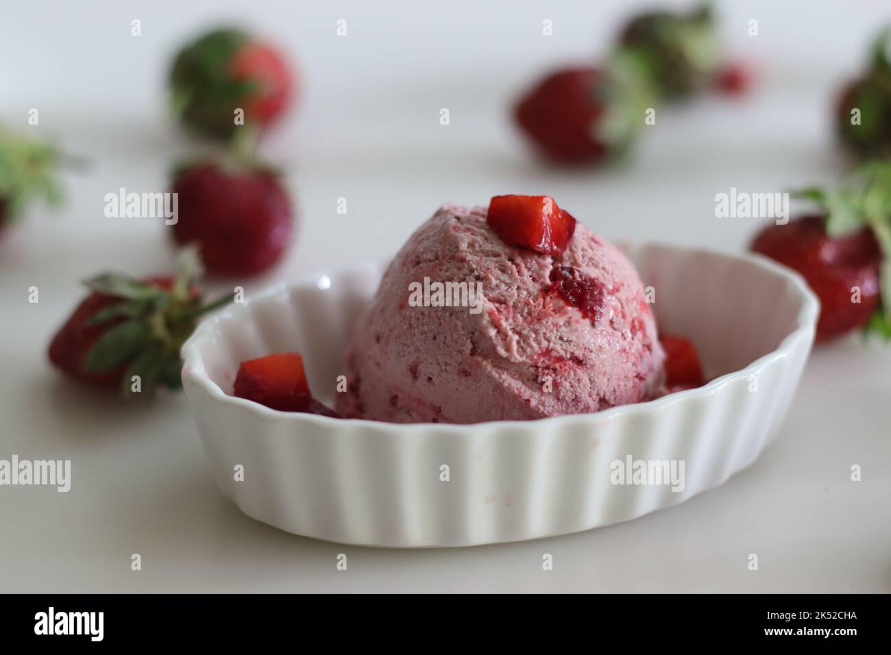 Scoops of Homemade strawberry ice cream. Three ingredient ice cream