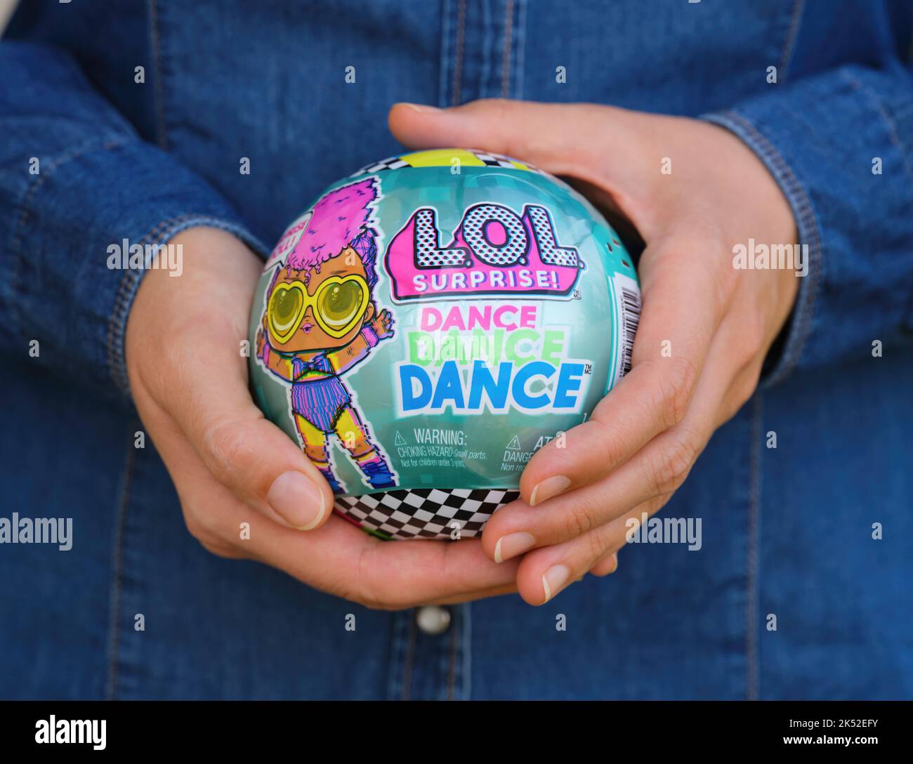 Tambov, Russian Federation - October 02, 2022 Woman holding The LOL Surprise Dance Dance Dance ball with doll inside it. Stock Photo