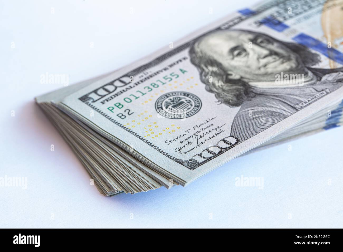Pile of 100 dollar banknotes on white background for design purpose ...