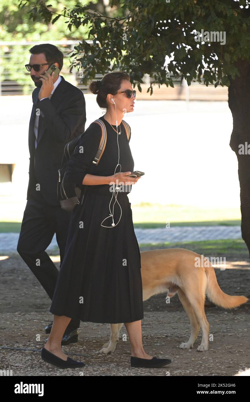 Catrinel Marlon (R) and companion Massimiliano Di Lodovico (L) walk