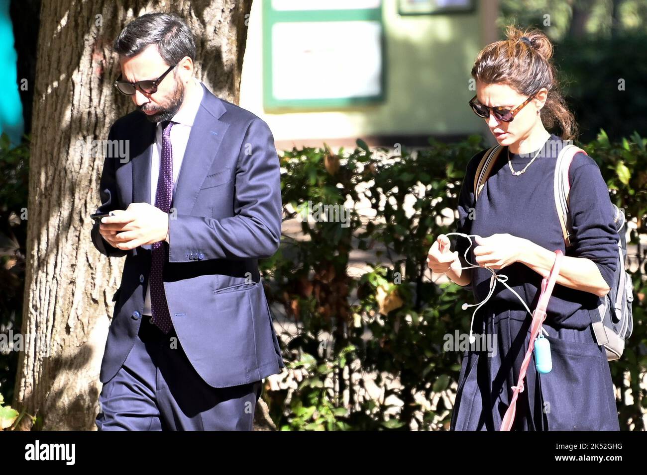 Catrinel Marlon (R) and companion Massimiliano Di Lodovico (L) walk
