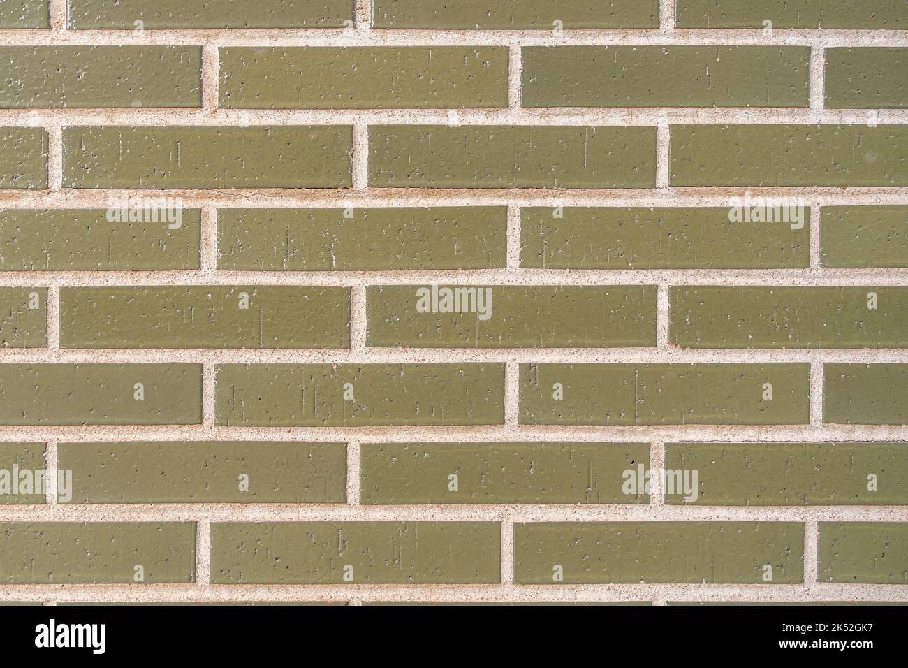 green vintage brick wall with decayed structure. Stock Photo