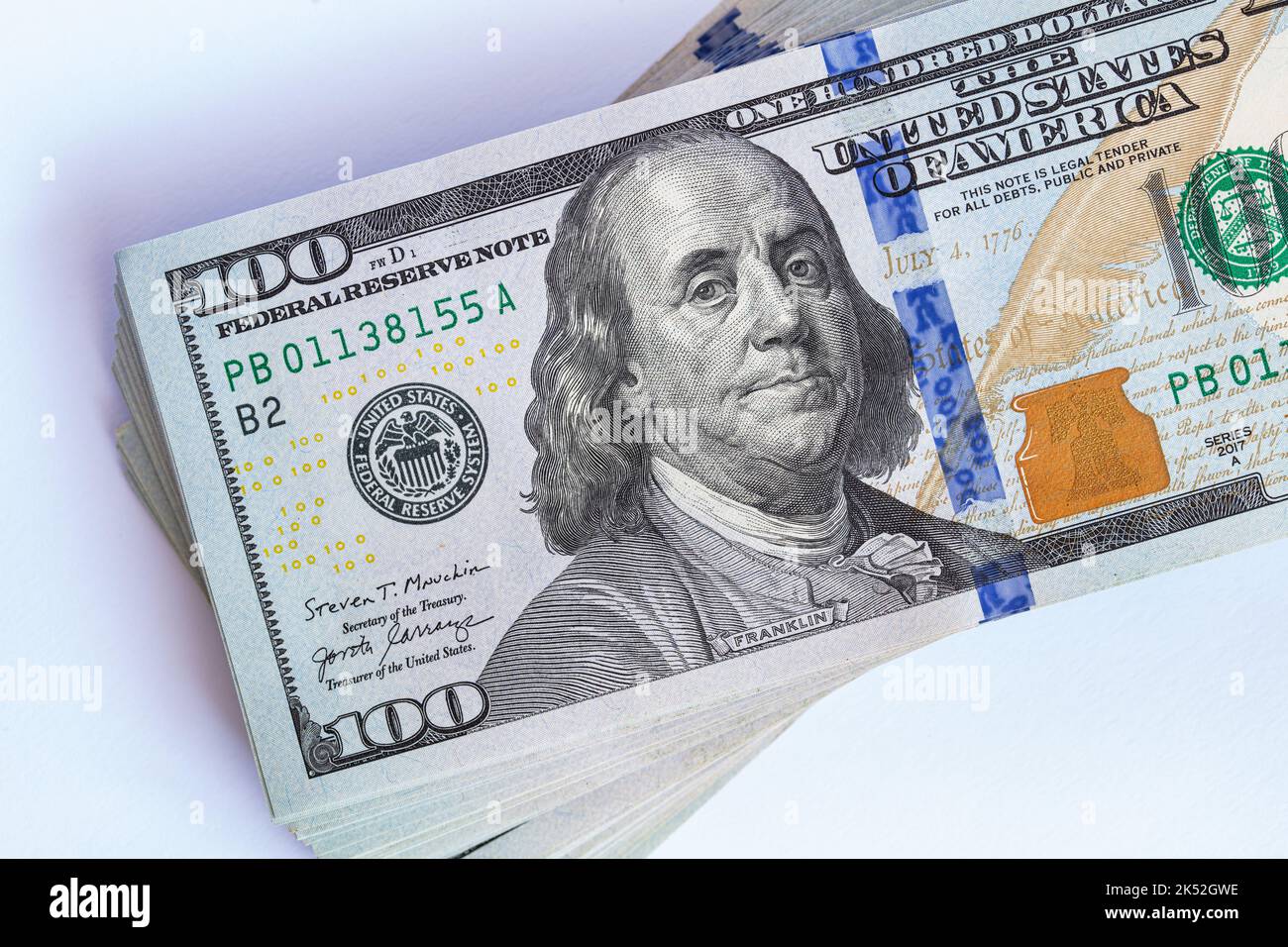 Pile of 100 dollar banknotes on white background for design purpose ...