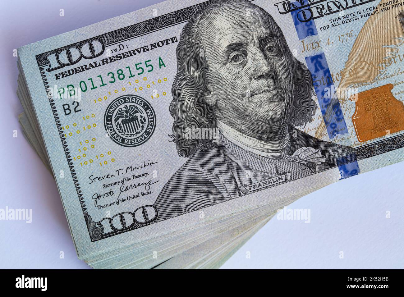 Pile of 100 dollar banknotes on white background for design purpose ...