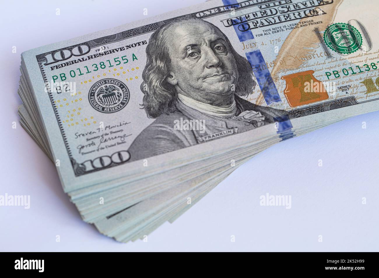 Pile of 100 dollar banknotes on white background for design purpose ...