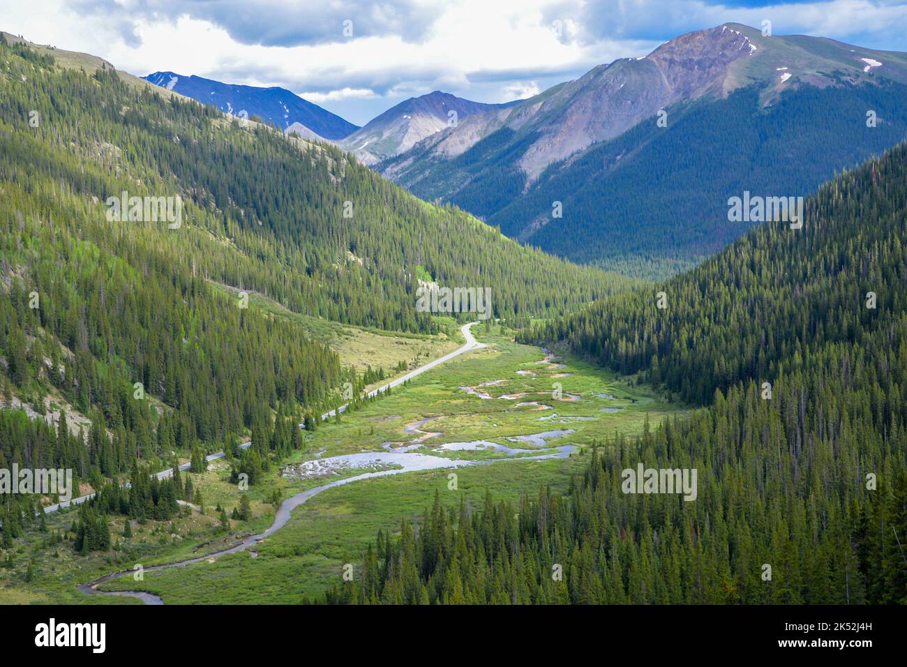 Elevated view of the valley and road below with a river heading towards