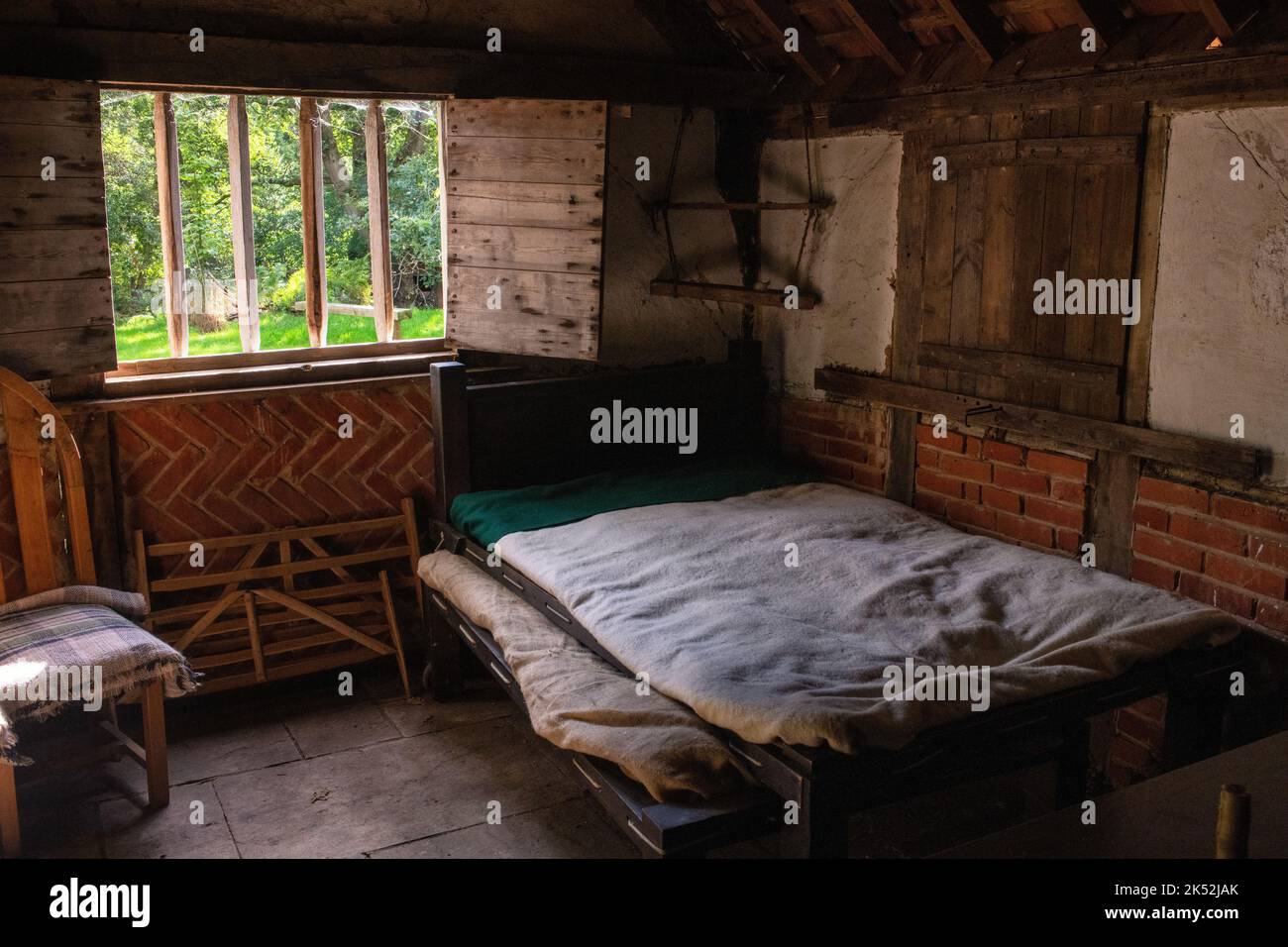 Interior and bed of a 1642 village house at Little Woodham, Gosport, England, the charity showing life at the start of the Civil War. Stock Photo