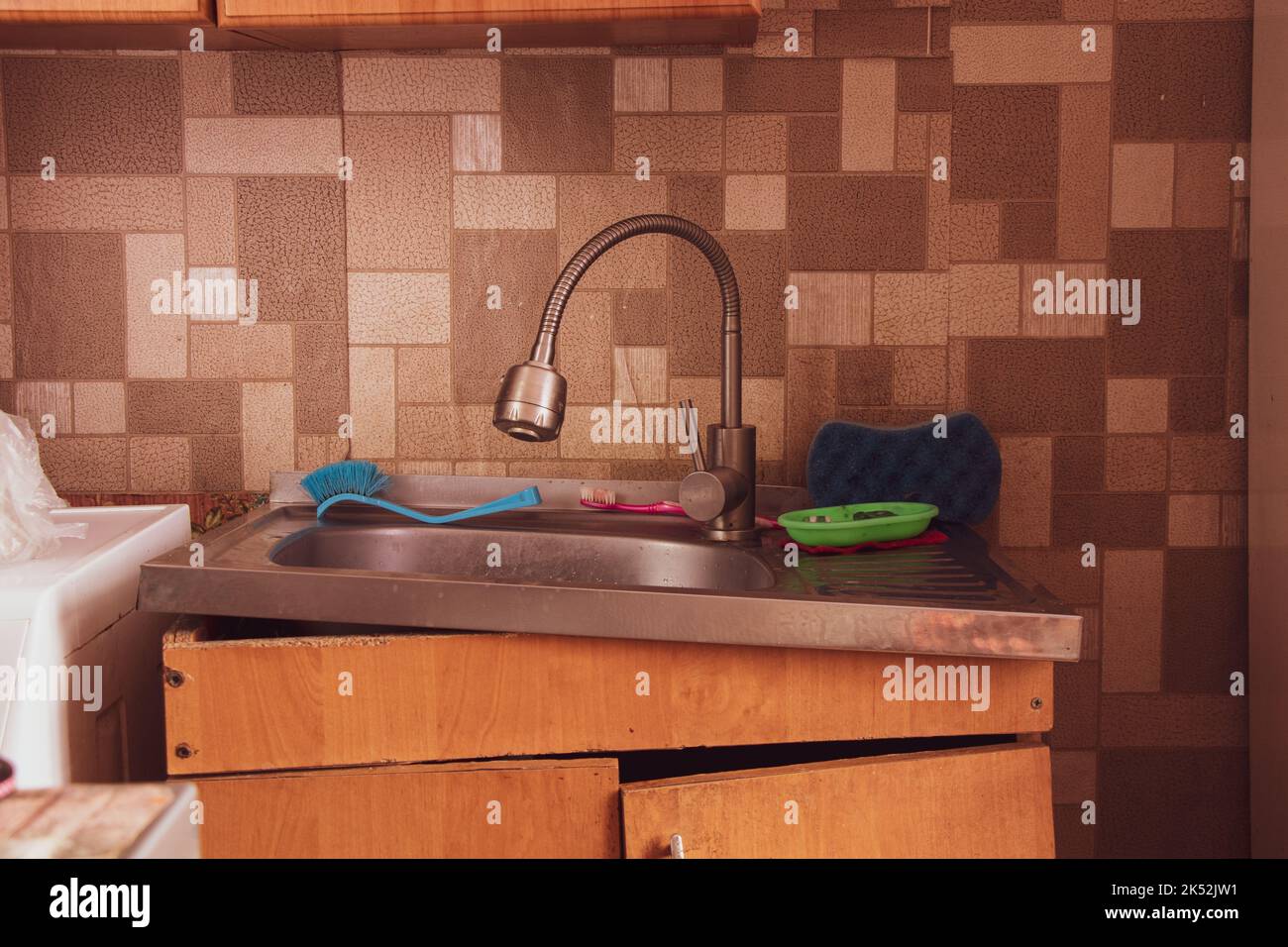 Soviet apartment, kitchen sink in the kitchen, broken bedside table