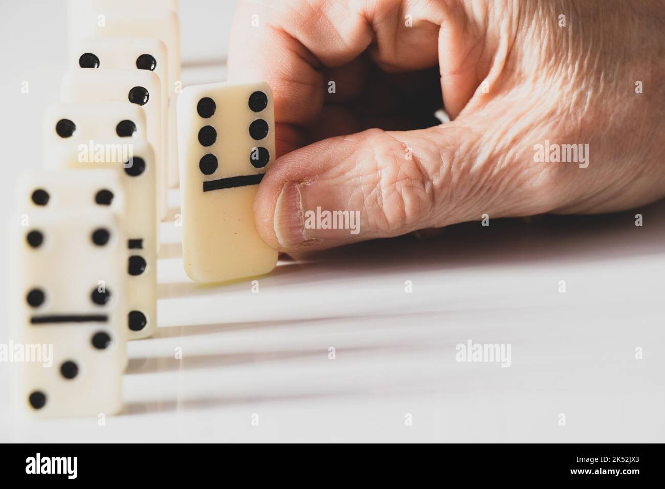 female old hand playing dominoes,gambling and hobby Stock Photo