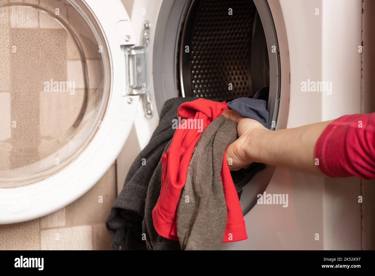 things in the washing machine, washing machine with things at home in