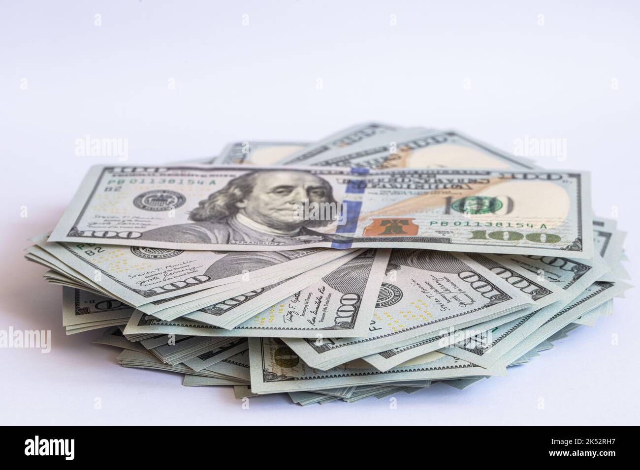 Pile of 100 dollar banknotes on white background for design purpose ...