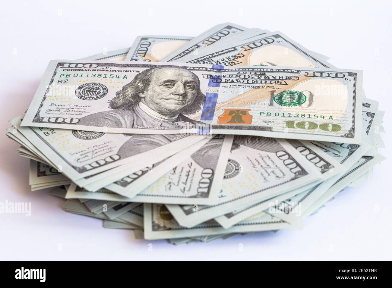 Pile of 100 dollar banknotes on white background for design purpose ...