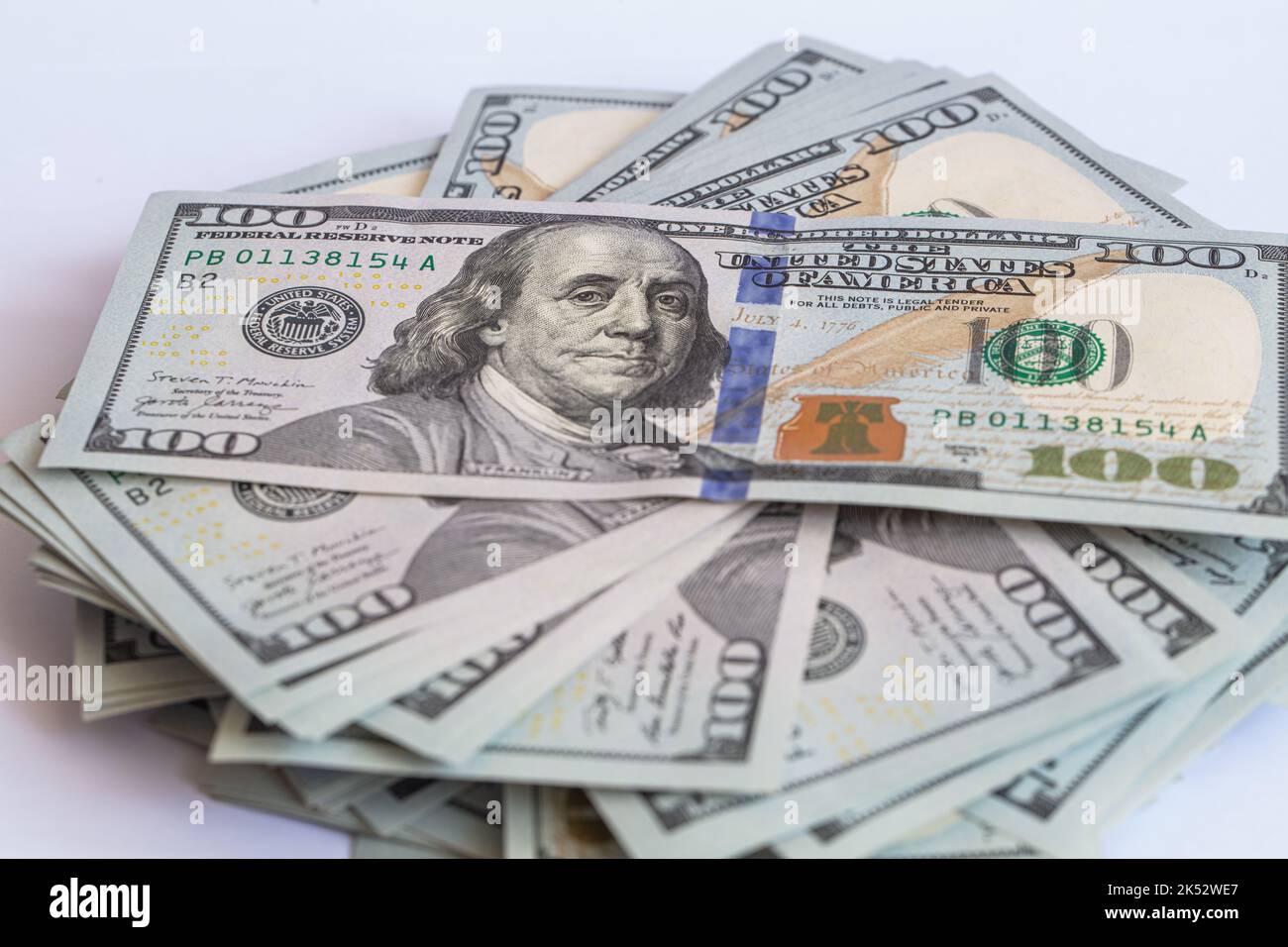 Pile of 100 dollar banknotes on white background for design purpose ...