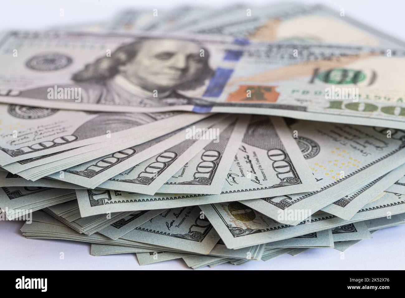 Pile of 100 dollar banknotes on white background for design purpose ...