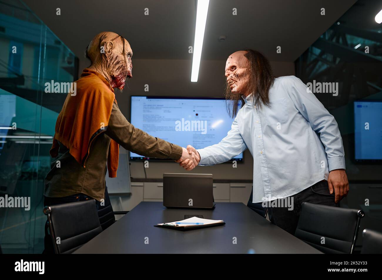 Zombie businessmen handshake to confirm deal Stock Photo