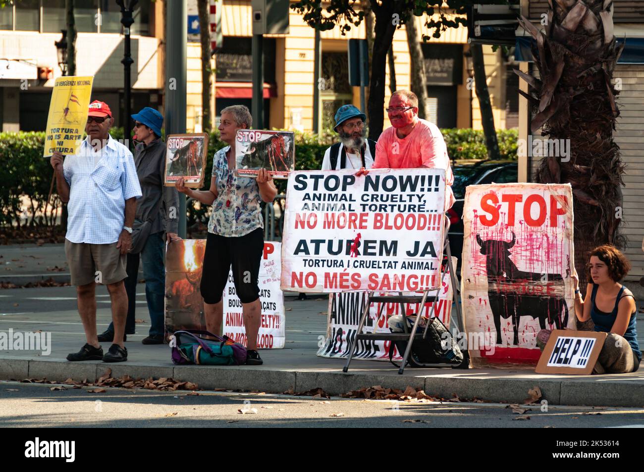 BARCELONA, SPAIN -  AUGUST 21, 2011: a group of animal rights activists protests against bullfighting in the city of Barcelona stop tortura Stock Photo